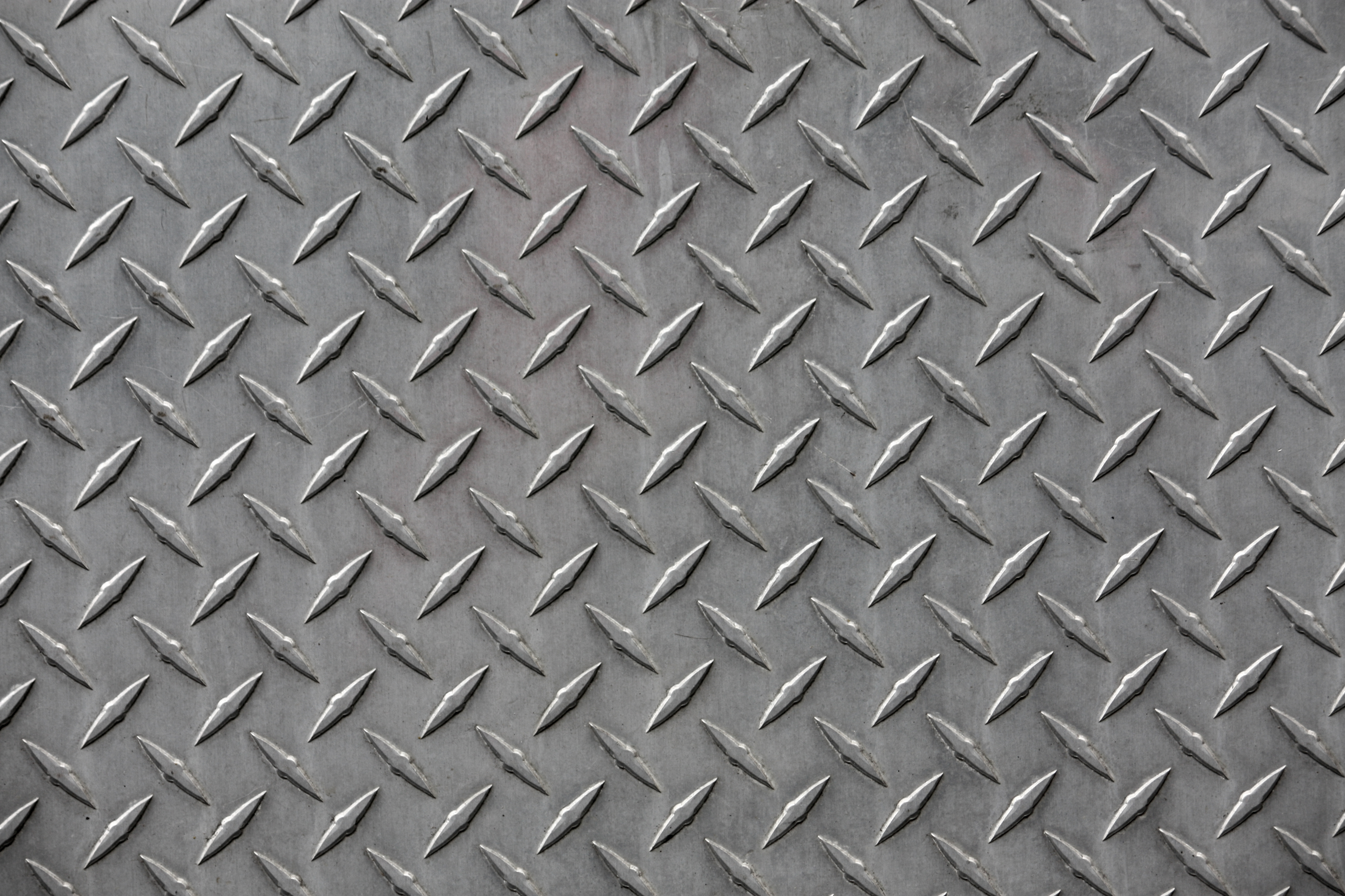 Steel chequered plate with raised anti-slip pattern
